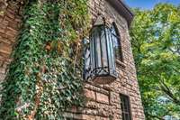 This gives a  a Repunzel fairytale feel as the turret incases a hexagon shaped aged stone dining room with a gorgeous fireplace