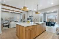 Kitchen Overlooks Both Living Room and Vaulted Dining Room