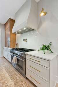 Range Wall Features Thermador Dual Fuel Range and Quartz Slab Backsplash