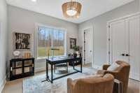 Bedroom 2, Located on the First Floor at the Front of the Home features a Connected Ensuite and Built In Closet Storage