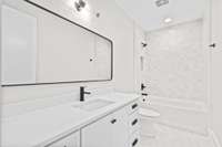 Bathroom 3 Features Tub/Shower Combo and Black and White Design