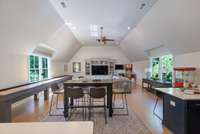 Expansive bonus room with vaulted ceilings and abundant natural light—ideal for a game room, media space, or family gatherings.