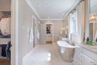 Luxurious primary bathroom with a freestanding soaking tub, dual vanities, and elegant finishes for a true spa experience