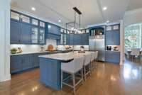 Showcase kitchen with marble countertops, and a spacious island—perfect for entertaining and everyday living.