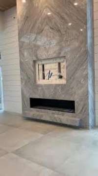 Thin-line fireplace creates a warm sophisticated vibe for entertaining.  Images are inspirational photos and not of actual property.