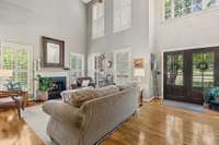 Great Room With Gas Logs And Hardwood Flooring