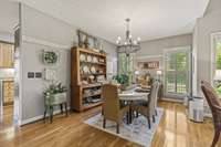 Dining Room With Hardwood Flooring And New Upgraded Lighting