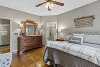 Primary Bedroom With Ceiling Fan And Large Walk In Closet