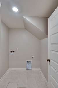 Behind the door to the laundry room is a full set of shelves!