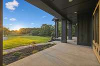The outlook from your new front door. Manicured landscaping beds in both homes.