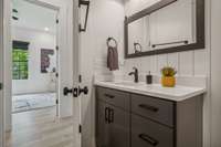 This lovely full bathroom, with shower, is just off the hallway to Bedroom #3