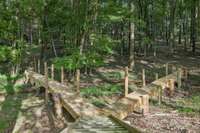Decks and walkways lead you through the course and into the woods