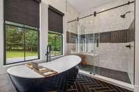 Custom tile work throughout the primary bathroom