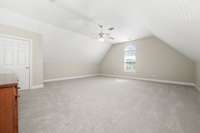 Spacious bonus over two car garage with attic storage behind the left door