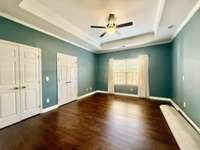 Primary Suite has double closets with new hardwood flooring