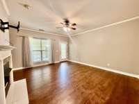 Full Living Room overlooking Covered patio and covered 2 carport with extra storage outside ;
