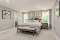Large primary suite with two walk in closets.