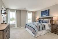 Two of two secondary bedrooms - queen bed shown