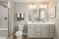 Primary bathroom shown with walk-in stand up shower (upgraded option)