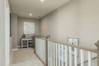 Upstairs landing with small loft, perfect for a desk or your furry friend's bed!