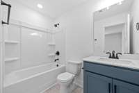 Second suite has its own full bathroom with custom cabinets and quartz countertops