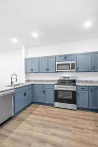 Big spacious kitchen, lots of custom craftsman cabinets with shaker style doors and soft close drawers, stainless steel appliances and granite counters.