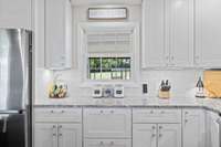 Renovated with granite counter tops, new cupboards and stainless steel appliances.