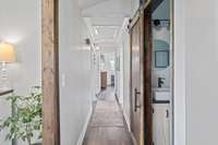 Hallway leading to bathrooms and bedrooms.