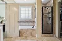 Enjoy a spa-like experience with recessed lighting, a separate soaking tub, and a stand-alone shower. 2028 Martins Bend Dr.  La Vergne, TN 37086