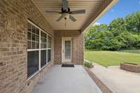 A partially covered concrete patio offers a comfortable outdoor space complete with a ceiling fan for added comfort. 2028 Martins Bend Dr.  La Vergne, TN 37086
