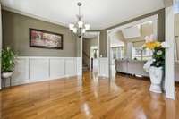 The formal dining room showcases elegant wainscoting and a stylish overhead fixture. 2028 Martins Bend Dr.  La Vergne, TN 37086