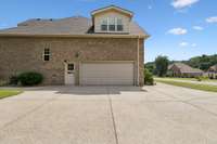 The 2-car garage features a large parking pad and man-door access! 2028 Martins Bend Dr.  La Vergne, TN 37086