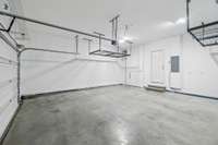 Garage with hanging storage and wall storage system