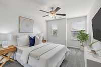 Guest bedroom with ample natural lighting and ceiling fan