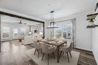 Dining area has upgraded lighting and open concept to kitchen and living room