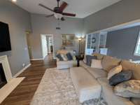 Ceiling fan keeps a gentle breeze flowing. Note the practically care-free vinyl wood look flooring.