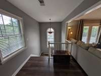 Tons of natural light at the office at the top of the stairs.