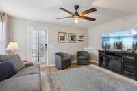 Open floor plan living room - great space with lots of natural lighting and door to your outside private patio.