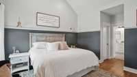 Dual walk-in closets are located in the alcove leading to the primary bathroom suite.