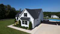 Located on a corner lot with trees to the right and front, this home exudes peacefulness.
