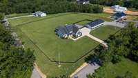 Aerial view of the entire fenced lot.