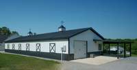 Equestrian inspired architecture and decorative cupolas render this outbuilding gorgeous as well as functional.