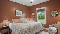 Bedroom #3 is painted a serene terracotta.  It overlooks the backyard and has a double door oversized closet.