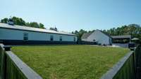 A portion of the yard is cross-fenced for privacy around the pool.