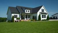 Handsome landscaping surrounds the home and just adds to the beauty!