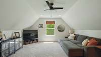 Located over the attached 2-car garage is a bonus/rec room.