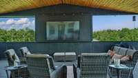 The expansive covered back porch will WOW you!  The vaulted ceiling is finished with tongue and groove.