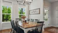The Dining Room is located just inside the door and overlooks the serene front yard.