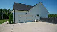 2-car side entry garage to the home has a large parking area for additional cars.