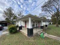 Wrap around porch and much more.. even a detached 1 car garage